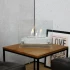 Small tabletop bio fireplace of steel and glass